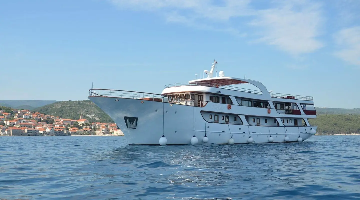 A luxury motor yacht Melody sailing in open water with its deck and hull visible