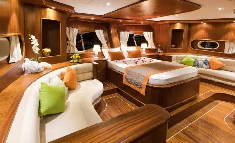 Yacht Vista Mare interior with polished wood panels and neatly arranged beds