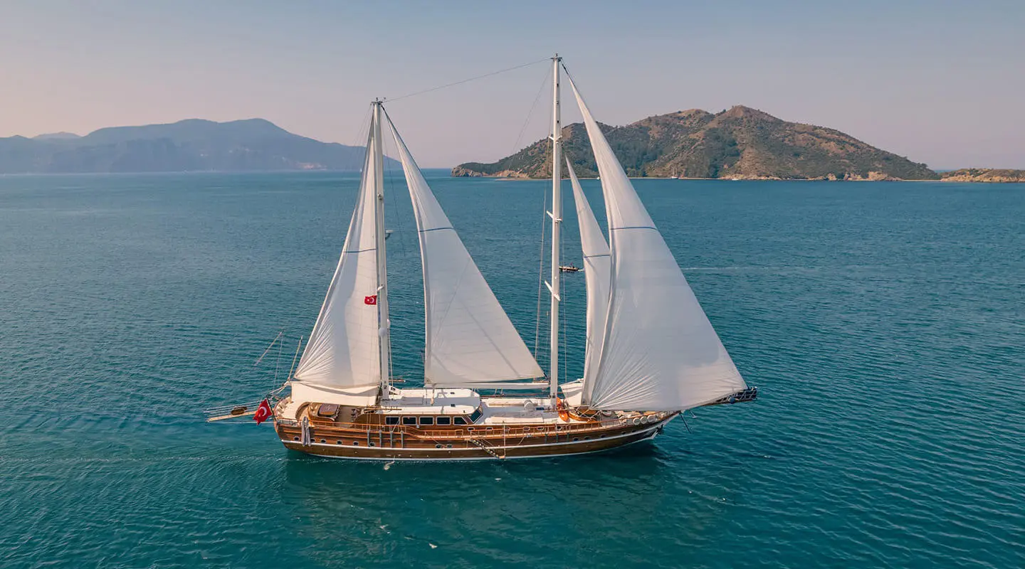 Lycian Queen luxury gulet anchored on blue water at sunset