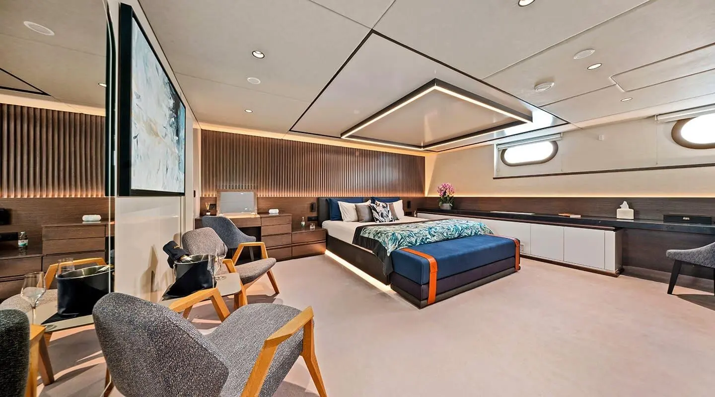 Interior of Anima Maris yacht with lounge chairs and built-in seating