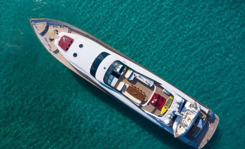 Aerial view of the Glaros yacht in turquoise sea, deck seating and cockpit