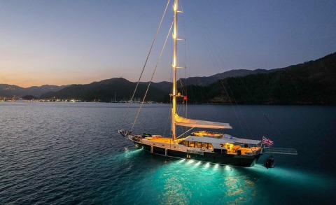 Sunset view of a luxury sailing gulet Good Life on calm sea