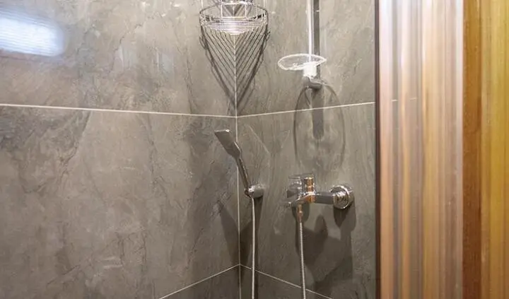 Cabin ensuite bathroom aboard Gozdem The One yacht, shower fixtures visible