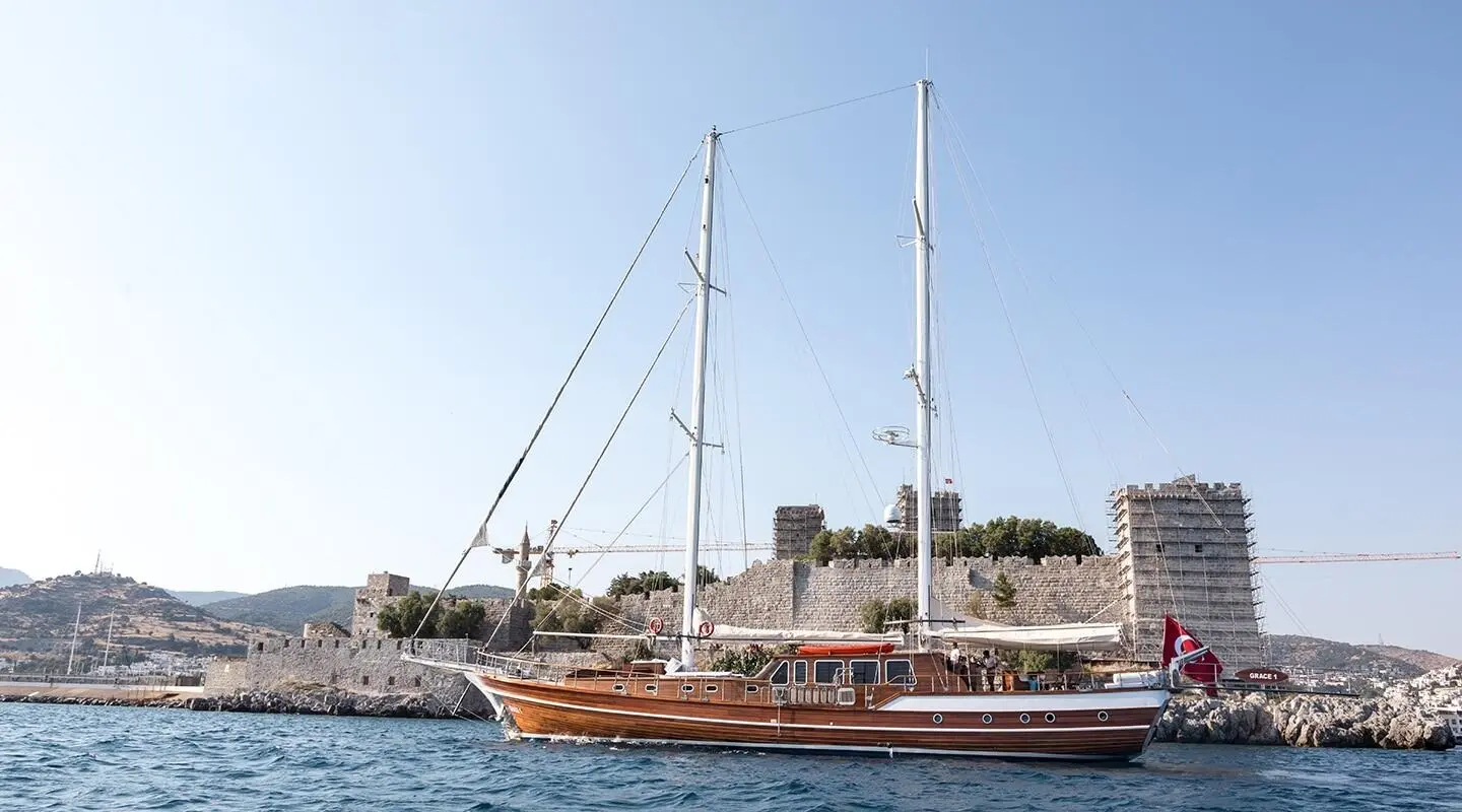 Grace 1 luxury gulet sailing at sunset with wooden hull and masts