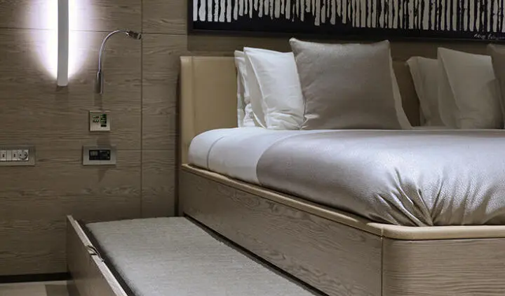 Master cabin on All About U 2 yacht with king bed and white linens