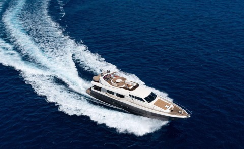 Lady Natassa yacht cruising in deep blue sea, sleek white hull slicing through waves