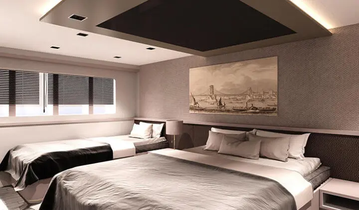 Master cabin with king bed, en-suite, neutral tones and windows