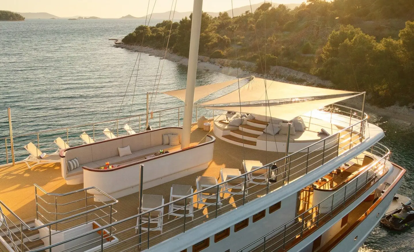 Sun deck on Bellezza motor yacht with seating, railing, and water view