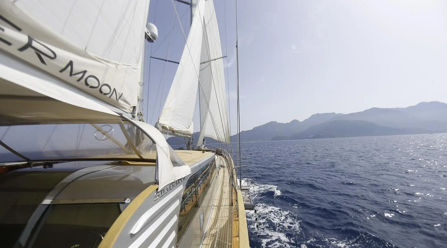 Deck view of Silver Moon gulet sailing with white sails on blue sea