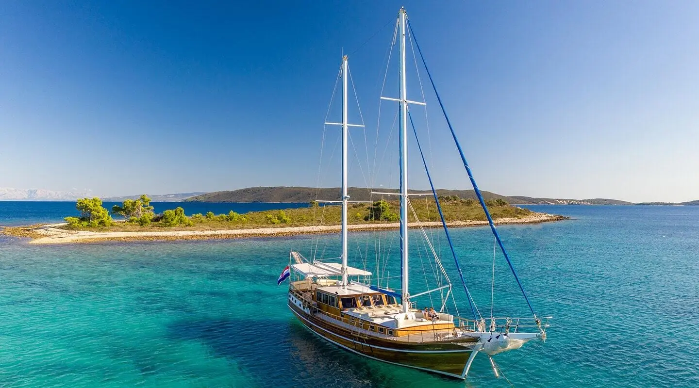 Andi Star luxury gulet anchored in turquoise water with clear sky