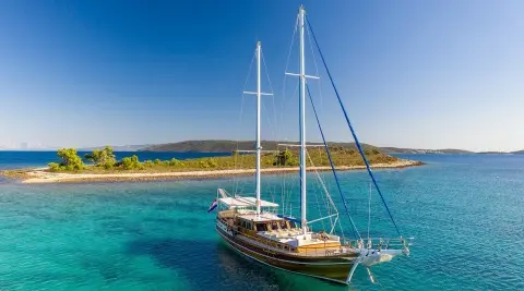 Andi Star luxury gulet anchored in turquoise water with clear sky