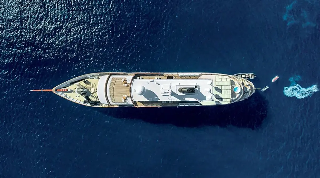Top-down view of Chakra luxury yacht sailing vessel on deep blue water