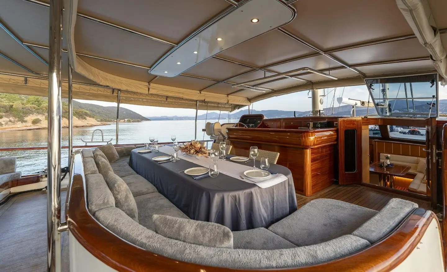 Aft deck lounge area on Gozdem The One yacht with curved seating.