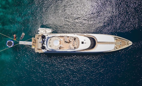 Top-down view of Daloli luxury motor yacht anchored in turquoise sea