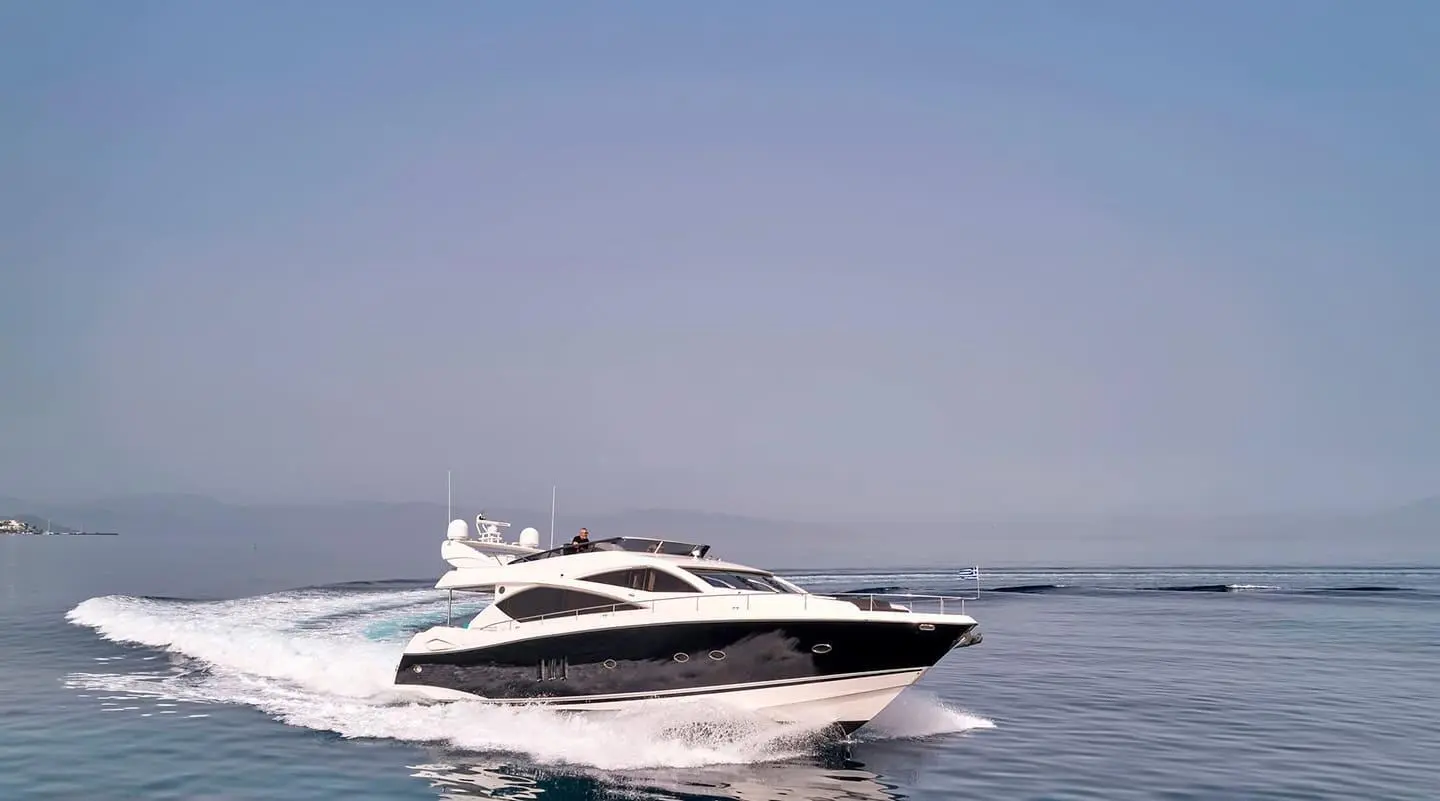 Yacht M Five cruising on calm blue water with clear sky