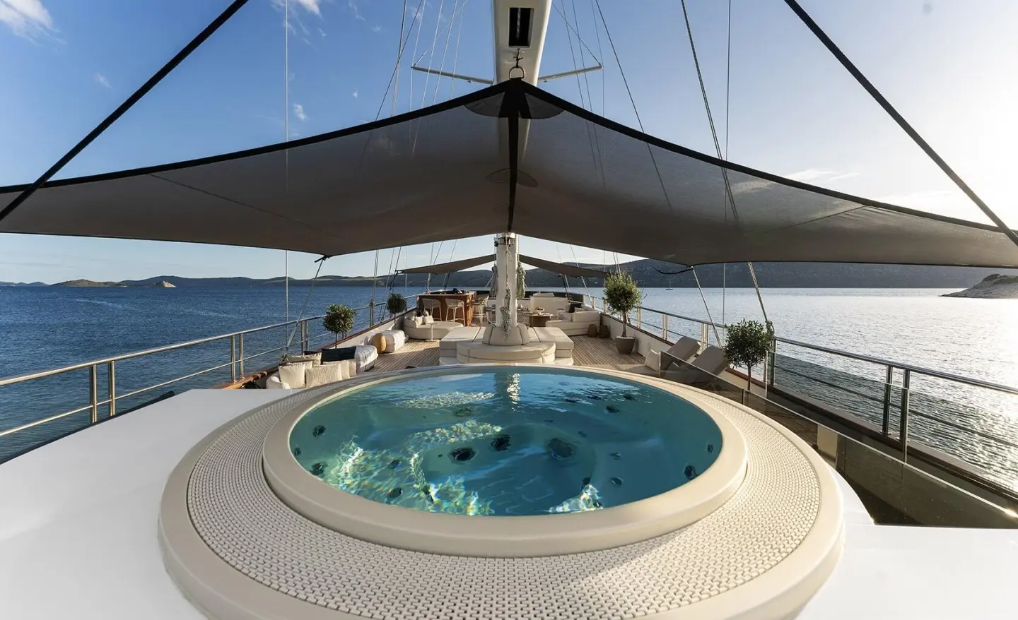 Maxita yacht sundeck with circular hot tub and shaded bimini area
