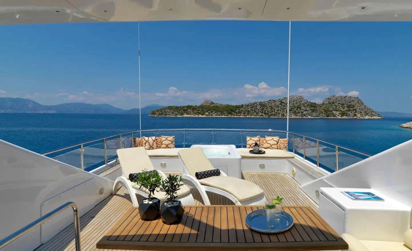 Yacht Idylle sundeck with table setting and ocean view offshore
