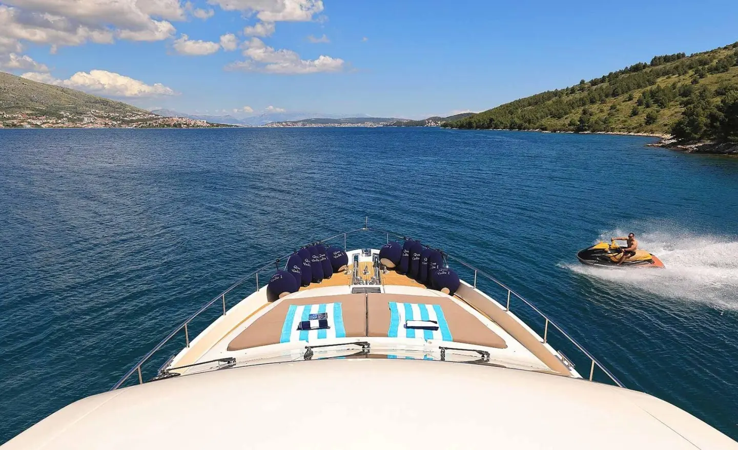 Bow deck view of Quo Vadis I yacht sailing calm blue waters