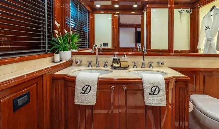 Divine yacht master cabin with large king bed, ensuite bathroom visible