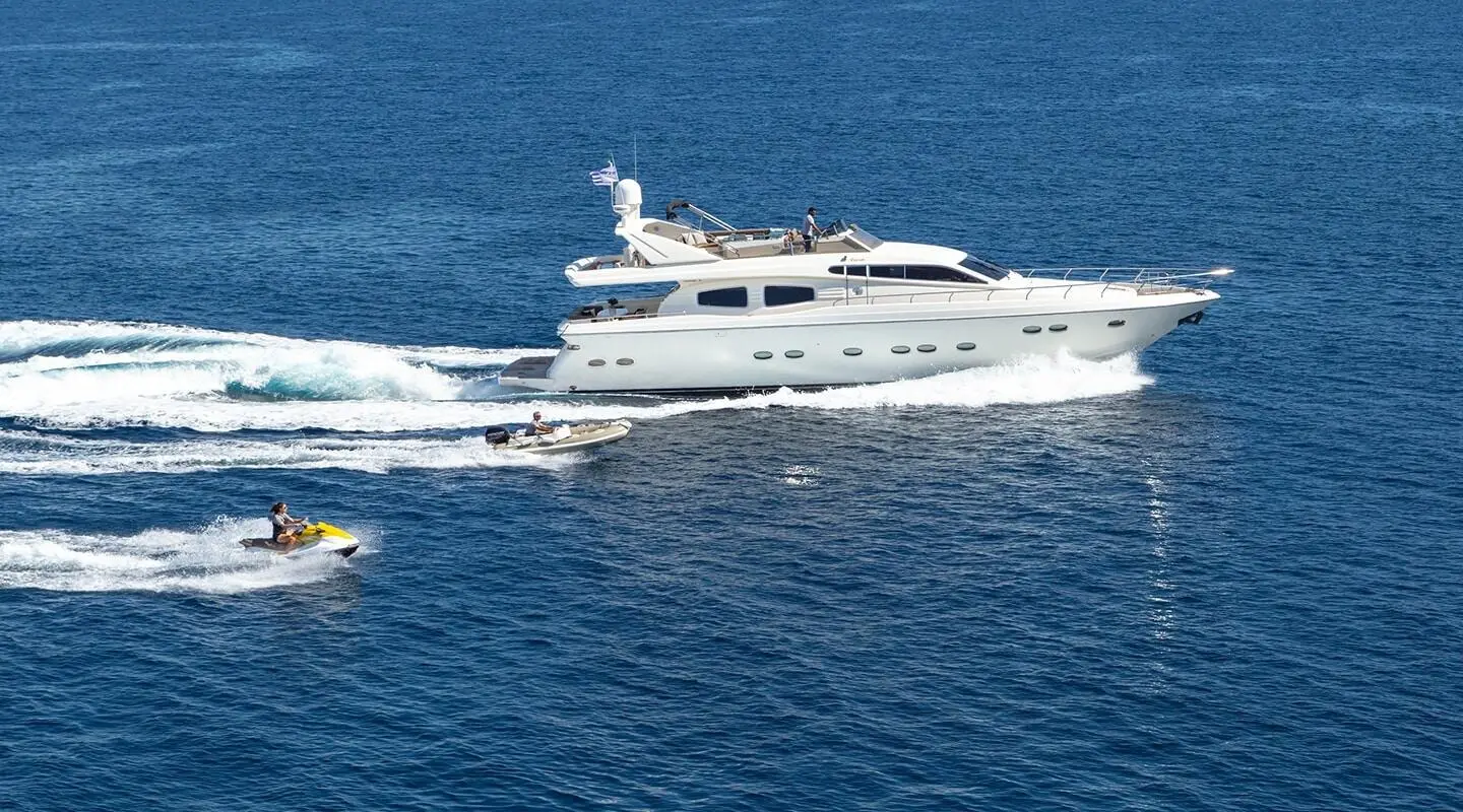 Amoraki luxury motor yacht cruising on blue sea with jet ski and tender aboard