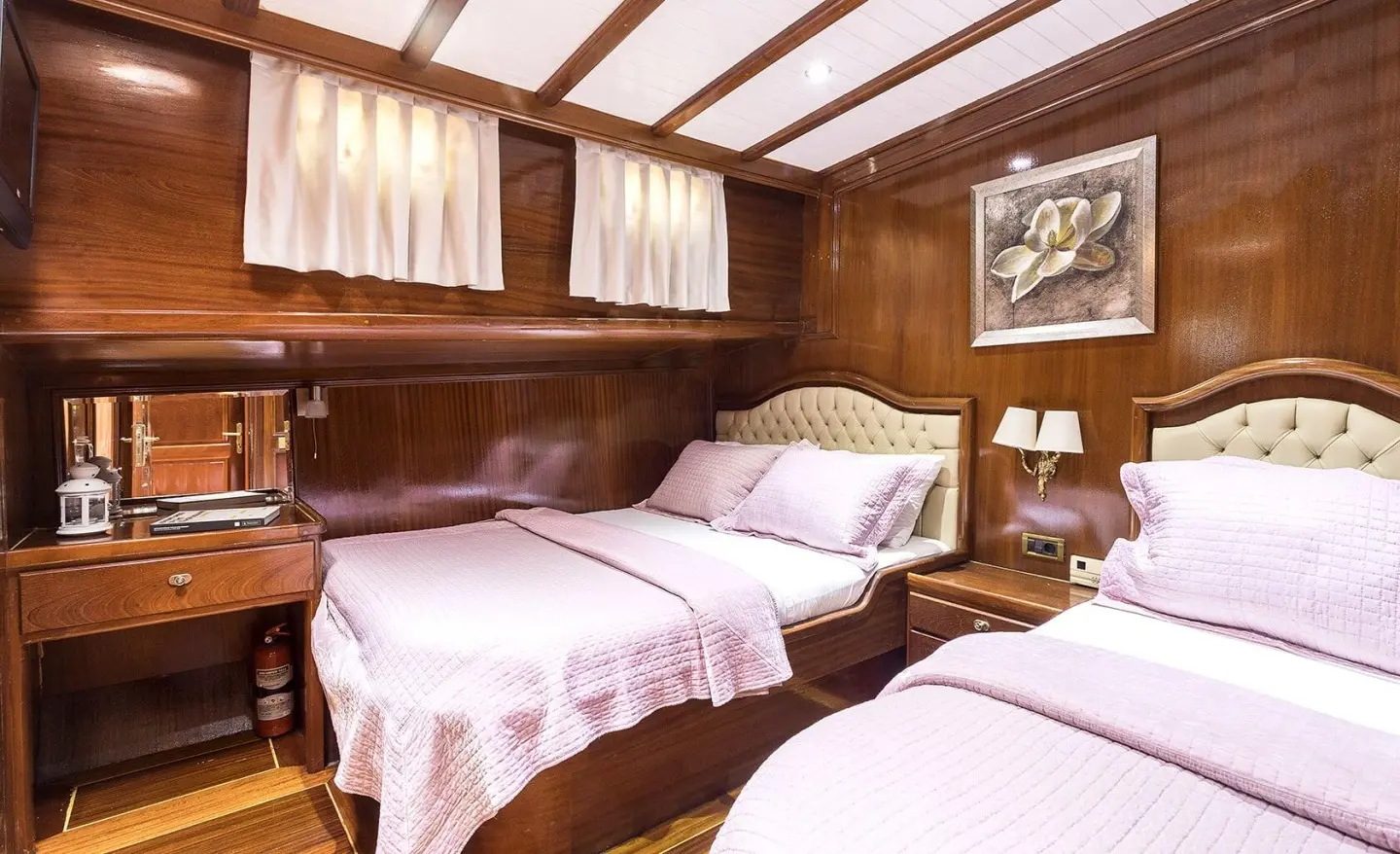 Grace 1 yacht bedroom interior with three single beds and wood paneling