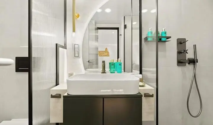 Master cabin with king bed, ensuite, modern lighting and mirror vanity