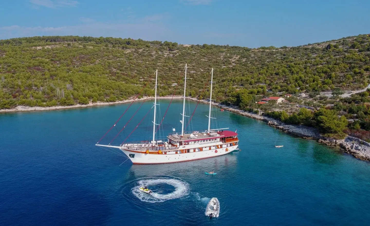 Amorena luxury yacht anchored in a turquoise cove with clear water