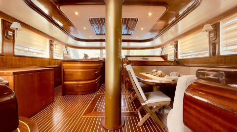 Diva Deniz gulet interior with wooden furniture and central pillar