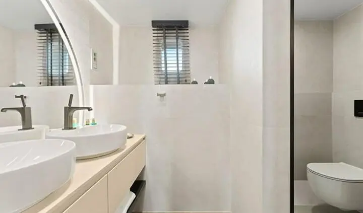 Master cabin with king bed and ensuite visible on Maxita yacht, cabin interior