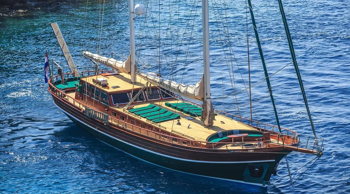 Carpe Diem 7 luxury gulet anchored at sea during sunset on calm blue water