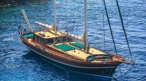Carpe Diem 7 luxury gulet anchored at sea during sunset on calm blue water