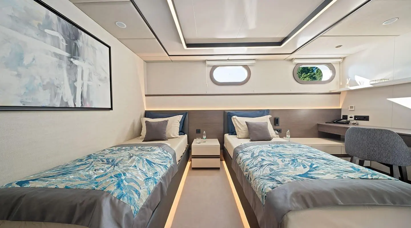 Interior of Anima Maris luxury yacht with twin sleeping berths and seating