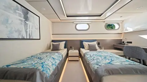 Interior of Anima Maris luxury yacht with twin sleeping berths and seating