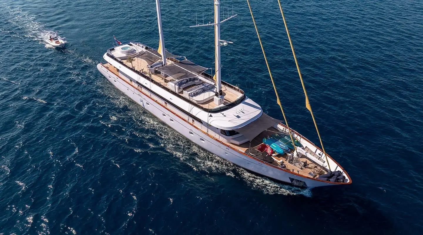 Aerial view of a sleek luxury yacht Anima Maris sailing blue sea