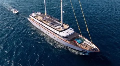 Aerial view of a sleek luxury yacht Anima Maris sailing blue sea