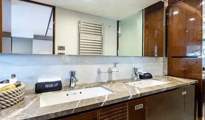 Vista yacht cabin sink area with marble countertop and twin sinks