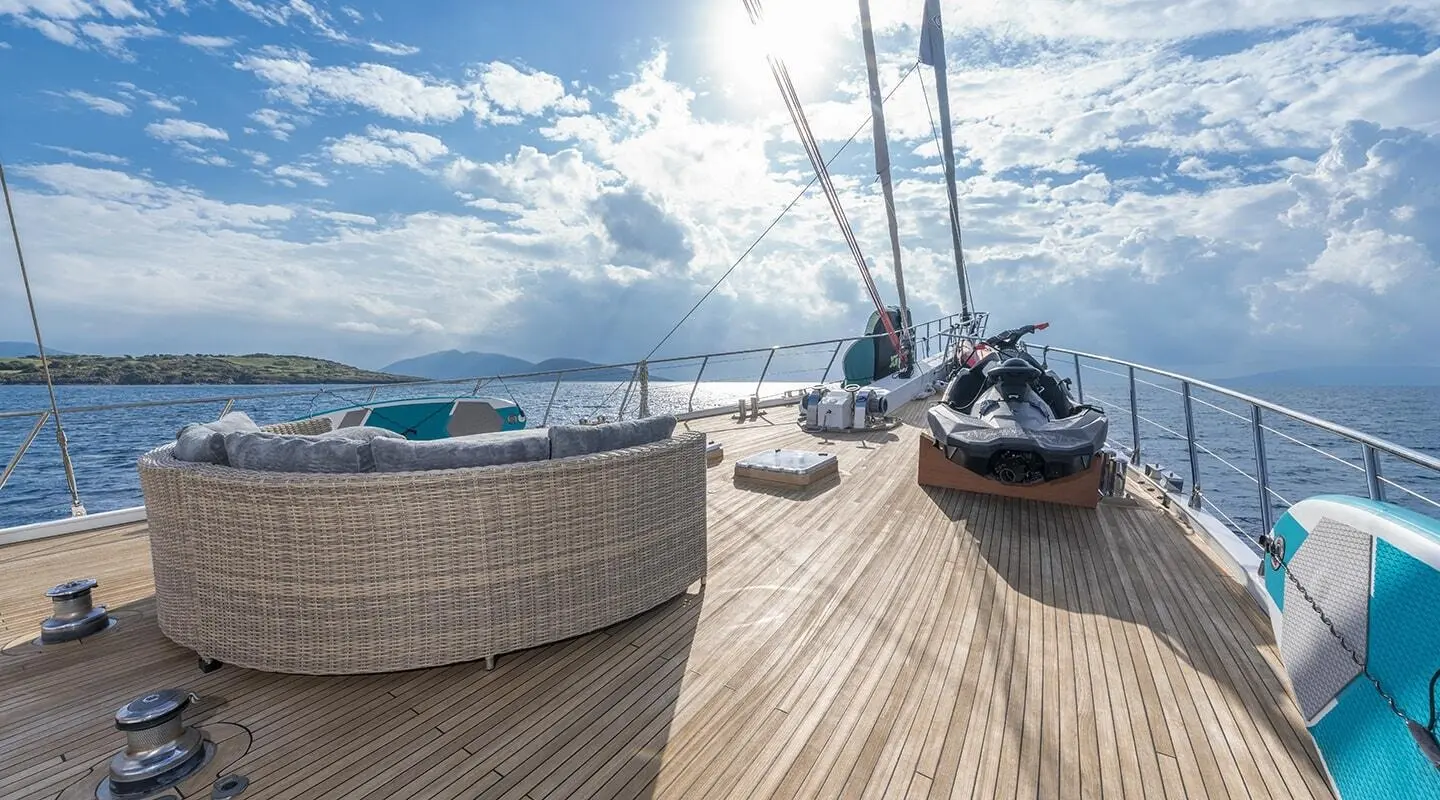 View from the bow of Gulet Lucky You, wooden deck with seating and ropes