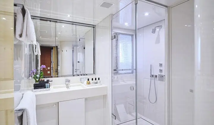 La Pellegrina 1 master cabin with king bed, ensuite bathroom visible