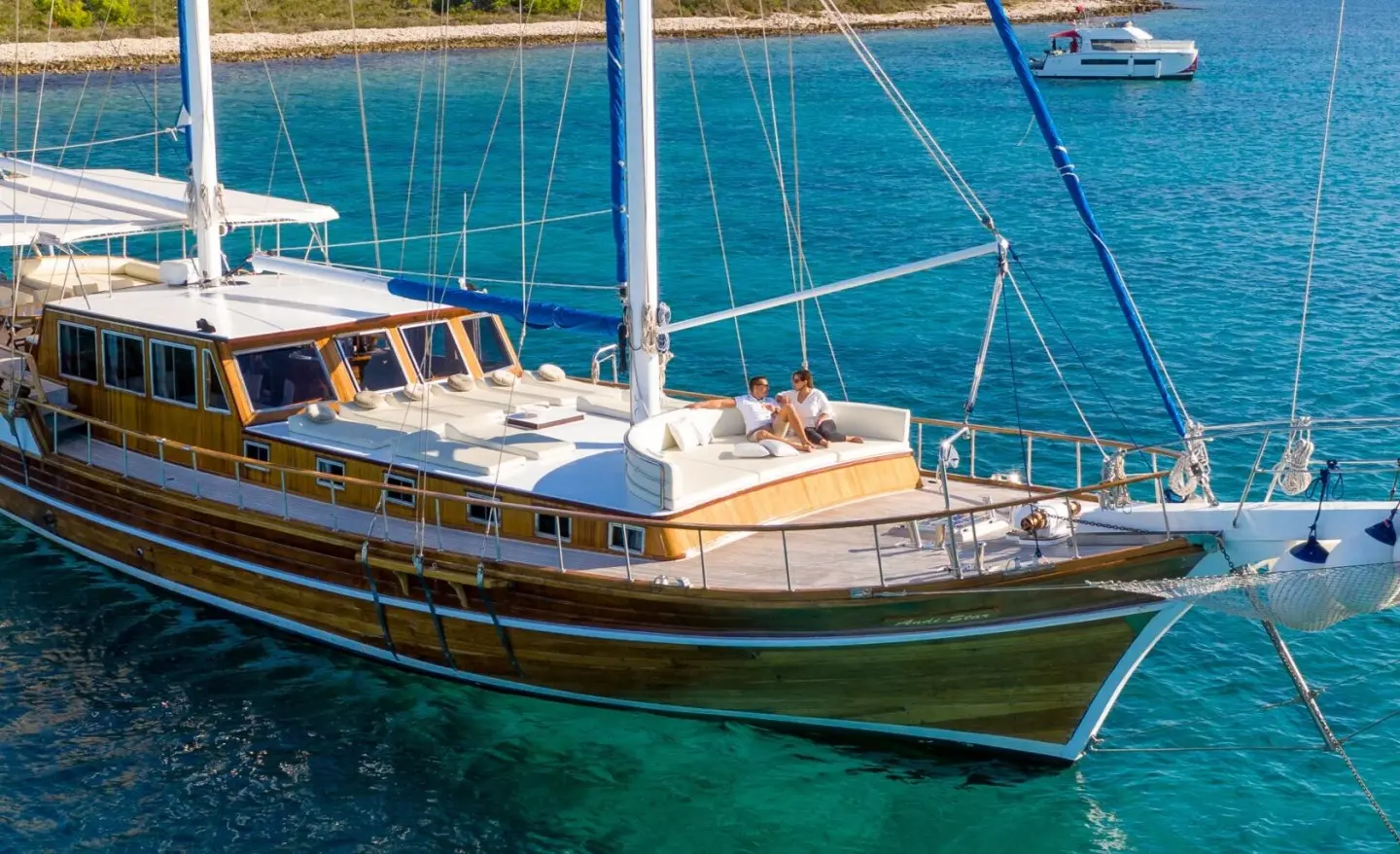 Andi Star luxury gulet at sea with blue water, deck, and sails visible