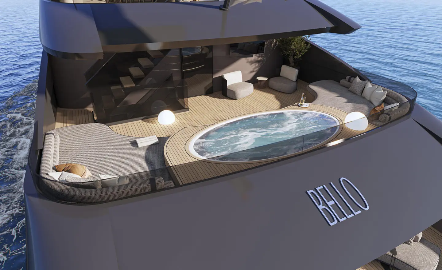 Bello yacht on the aft deck with oval hot tub and sunbathing area