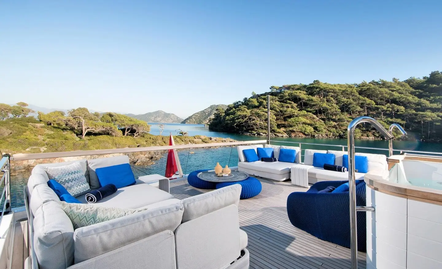 Morning Star yacht deck with blue seating, white cushions, and open sea view