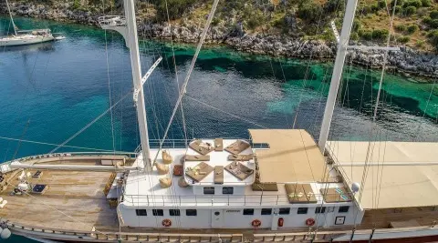 Tersane 8 yacht seen from above with wooden deck and seating at sunset
