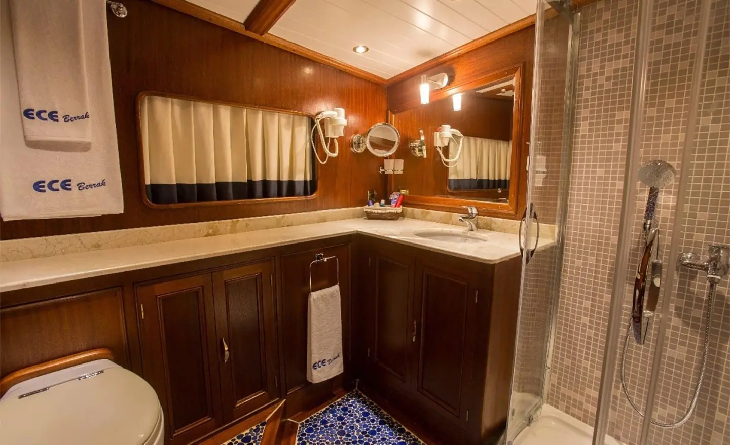 Wooden-paneled bathroom with sink, mirror and shower enclosure