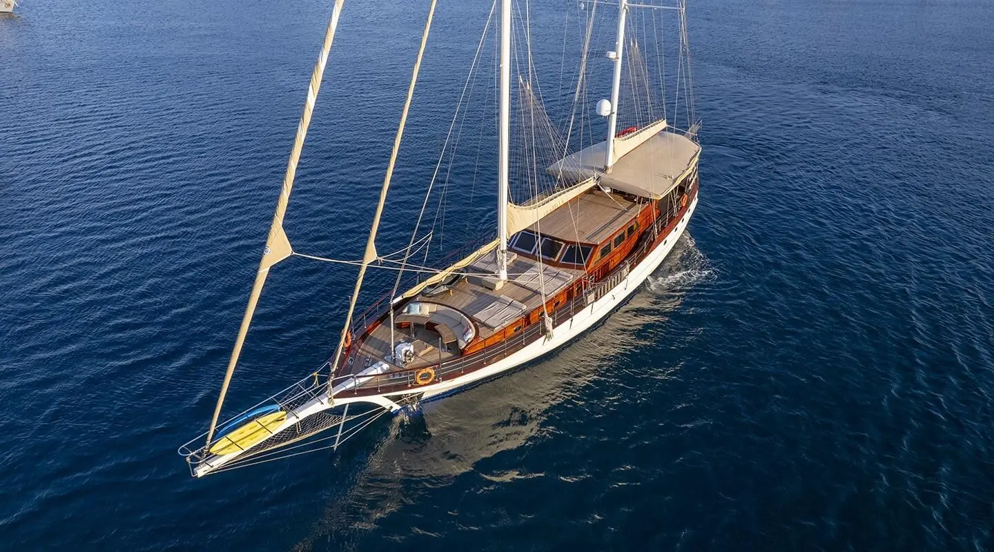 Luxurious sailing yacht with deck and masts on open sea