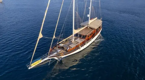 Luxurious sailing yacht with deck and masts on open sea