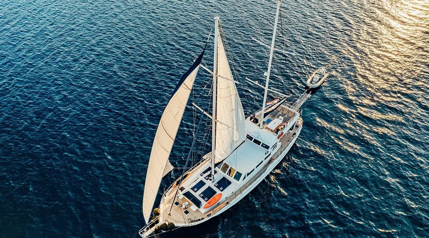 Aerial view of Maske luxury gulet sailing at sunset over blue sea