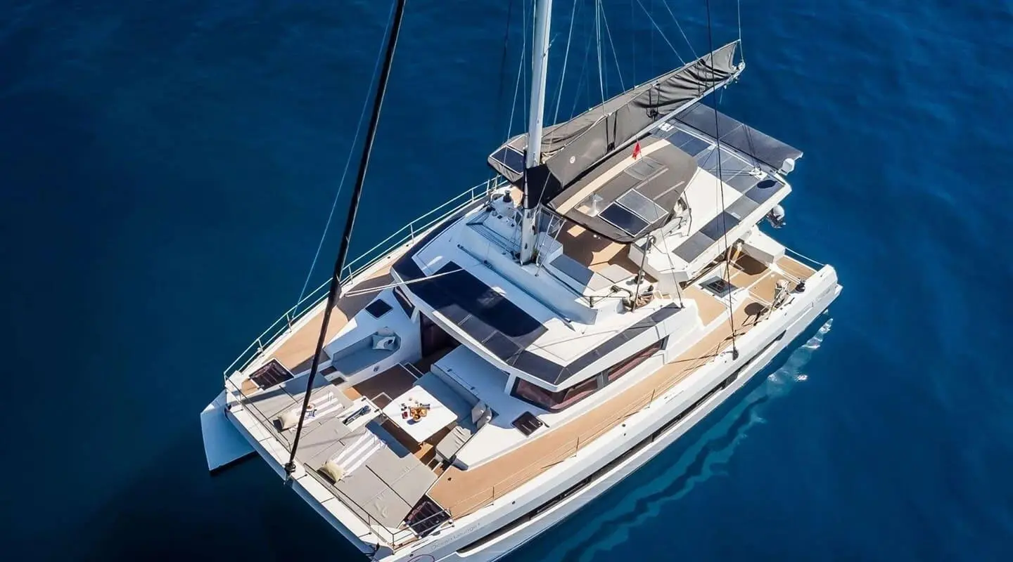 Aerial view of the Ocean Lounge motor yacht with a wooden deck on blue sea