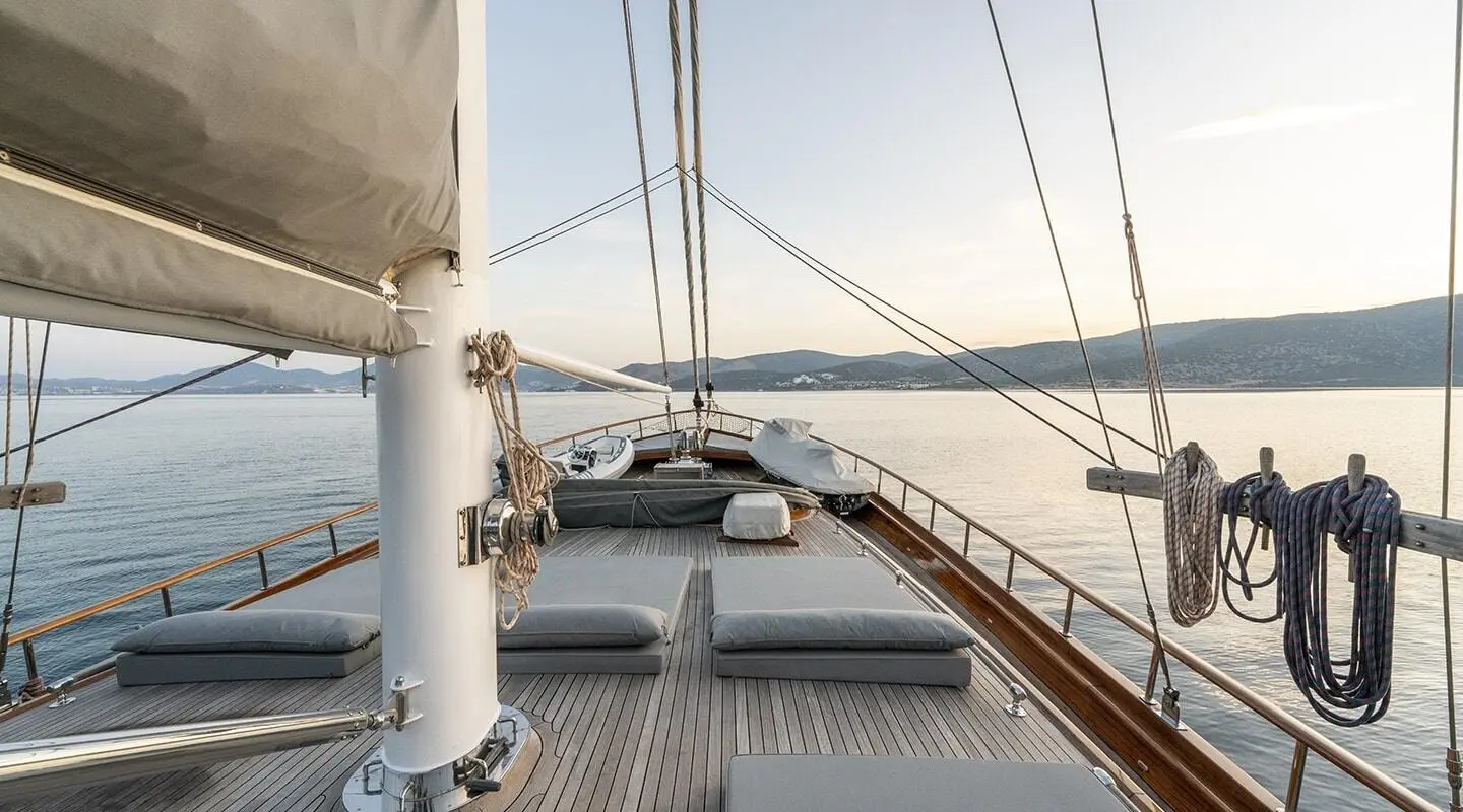 Bedia Sultan yacht deck at sunset with sun loungers and rigging