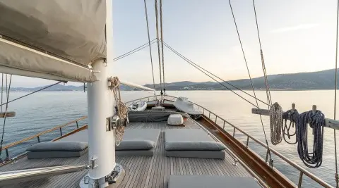 Bedia Sultan yacht deck at sunset with sun loungers and rigging