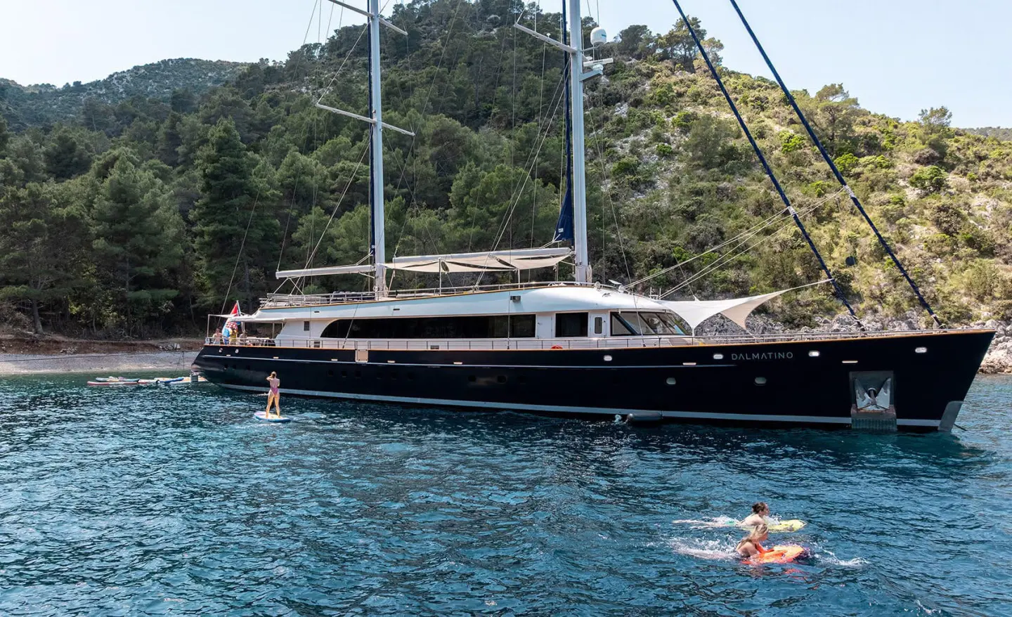 Dalmatino 44m sailing yacht anchored beside rocky coastline